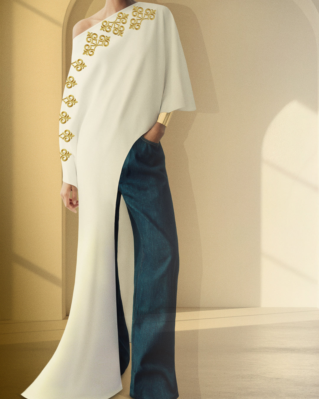 A white kaftan reimagined for the modern muse, lightweight, youthful, and effortlessly elegant paired with denim or tailored bottoms.