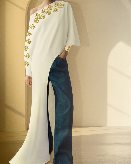 A white kaftan reimagined for the modern muse, lightweight, youthful, and effortlessly elegant paired with denim or tailored bottoms.