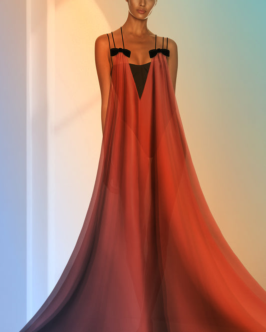 Red evening gown abaya with black bow details on a gradient background