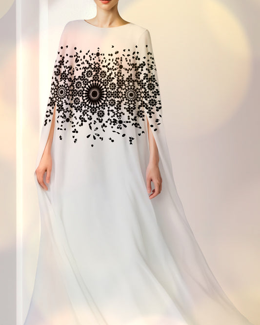Flowy white caftan with black modern design, lightweight royal garment for luxury occasions.